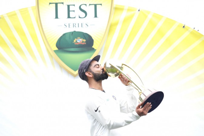 Virat Kohli kissing the Border-Gavaskar trophy after becoming the first captain to win a Test series in Australia. Virat Kohli India Cricket team