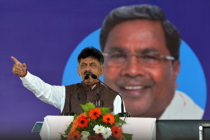 Karnataka minister for energy, D.K. Shivakumar, gestures while addressing the gathering during the inauguration of 'Shakti Sthala', the 1st phase of 2000 Megawatt solar power park in Pavagada Taluk, situated about 150 kms from Bangalore on March 1, 2018. The 1st phase of Shakti Sthala, which was inaugurated today is coming up in an area of 13,000 acres with an investment of 165,000 million rupees by the time of its completion is said to be the world's largest solar park. DK Shivakumar