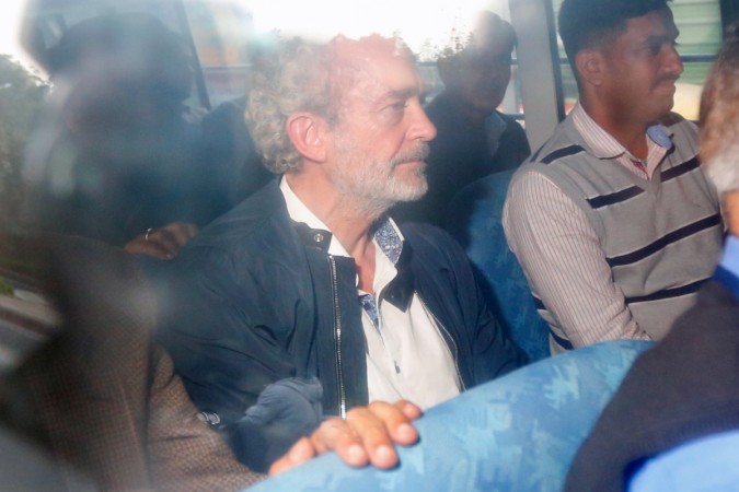 Christian Michel James (C), the alleged middleman in a deal between India and Anglo-Italian helicopter firm AgustaWestland, is pictured in a vehicle while leaving a district court in New Delhi Christian Michel