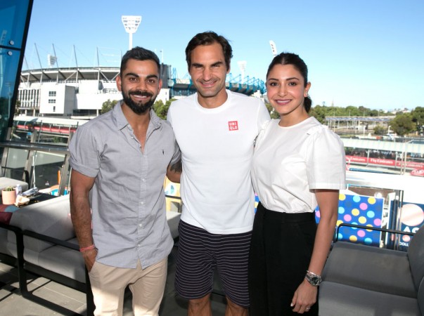 Virat Kohli and Anushka Sharma flank Roger Federer in Melbourne. Virat Kohli Roger Federer Anushka Sharma