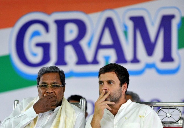 Vice President of the Indian National Congress, Rahul Gandhi (R) and Chief Minister of Karnataka, Siddaramaiah look on during the Gram Swaraj Samavesh, a convention of representatives of panchayats and urban local bodies, organised by the Karnataka Pradesh Congress Committee (KPCC) in Bangalore on October 9, 2015. Vice President of the Indian National Congress, Rahul Gandhi (R) and Chief Minister of Karnataka, Siddaramaiah
