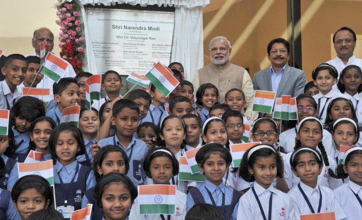 Prime Minister Narendra Modi with children at the inauguration of a new CBSE building, at Vidya Pratisthan Campus, in Baramati, Maharashtra on Feb 14, 2015. Also seen Maharashtra Governor C. Vidyasagar Rao and NCP chief Sharad Pawar. Prime Minister Narendra Modi
