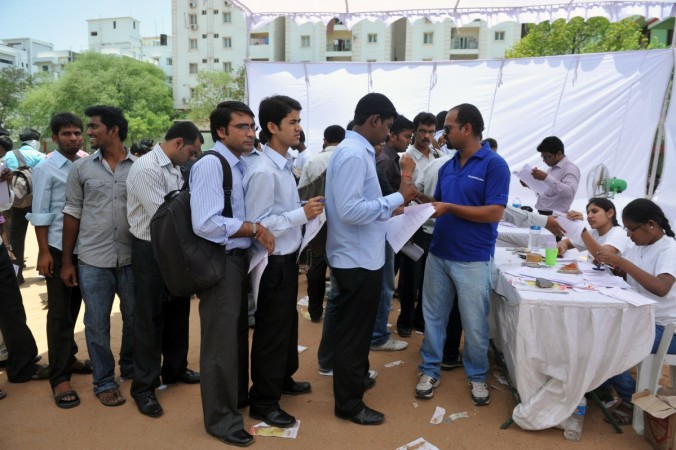 Job-seekers wait in line to register at a career fair held at a school in Hyderabad on May 19, 2012. Over 3,000 people attended the fair. Foreign investors have been turned off the country of 1.2 billion people due to recent regulatory moves by the government, which has stalled on a pro-growth reform agenda aimed at opening up the economy. Job-seekers wait in line to register at a career fair held at a school in Hyderabad on May 19, 2012