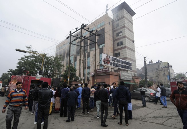 Onlookers gather outside Metro Hospital after a fire in the facility in Noida near the Indian capital New Delhi on February 7, 2019. - No casualties were immediately reported in the fire that was caused by a gas leak, according to Indian media. Onlookers gather outside Metro Hospital after a fire in the facility in Noida near the Indian capital New Delhi on February 7, 2019