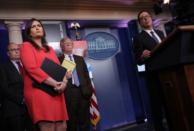 Director of the National Economic Council Larry Kudlow, White House press secretary Sarah Sanders, National Security Advisor John Bolton and Treasury Secretary Steve Mnuchin listen to questions from reporters during a press briefing at the White House January 28, 2019 in Washington, DC. During the briefing, economic sanctions against Venezuela's state owned oil company were announced in an effort to force Venezuelan President Maduro to step down. Sarah Sanders