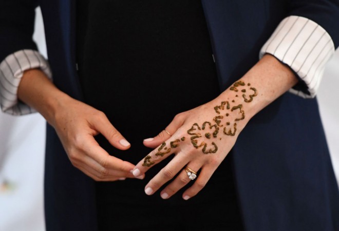 Meghan, Duchess of Sussex attends a Henna ceremony as she visits a boarding house in the town of Asni. Meghan Markle