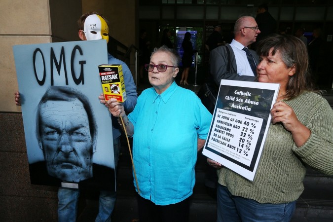 MELBOURNE, AUSTRALIA - MARCH 05: Protestors demonstrate after Cardinal George Pell arrives at Melbourne Magistrates' Court on March 5, 2018 in Melbourne, Australia. Cardinal Pell was charged on summons by Victoria Police on 29 June 2017 over multiple allegations of sexual assault. Cardinal Pell is Australia's highest ranking Catholic and the third most senior Catholic at the Vatican, where he was responsible for the church's finances. Cardinal Pell has leave from his Vatican position while he defends the charges. Cardinal George Pell sexual abuse protest