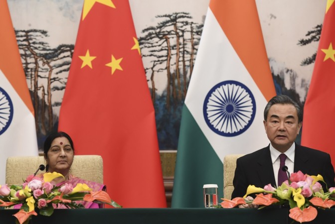 Indian Foreign Minister Sushma Swaraj (left) and Chinese Forein Minister Wang Yi (right) have a press conference after their meeting at the Diaoyutai State Guest House in Beijing, China, April 22, 2018. sushma swaraj china wang yi