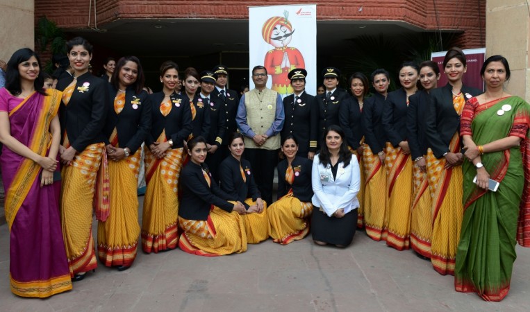 Chairman and Managing Director Air India, Ashwani Lohani (C) stands with the pilots and crew members of an all-women Air India, Delhi - San Francisco - Delhi flight as they pose for a photograph during an event on the eve of International Women's Day in New Delhi on March 7, 2017. A non-stop all-women flight from Delhi to San Franscisco travelled via the Pacific Ocean and returned via the Atlantic Ocean, completing a round trip of the world with 16 crew members and 250 passengers on-board. Chairman and Managing Director Air India, Ashwani Lohani (C) stands with the pilots and crew members of an all-women Air India