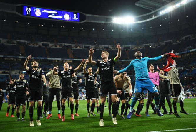 The Ajax players celebrating their historic victory over Real Madrid at the Santiago Bernabeu. Ajax