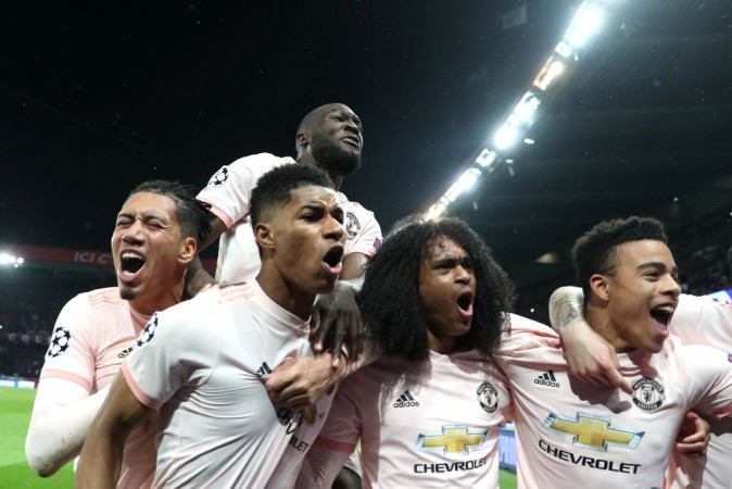 Manchester United players celebrating their historic victory in Paris. Manchester United