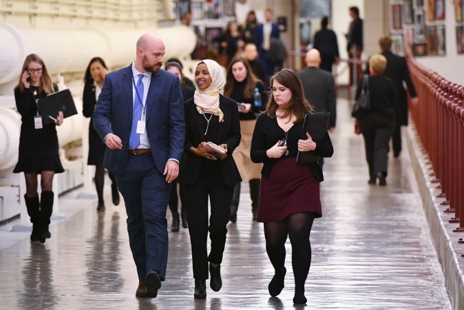 Representative Ilhan Omar (D-MN) (C) walks from the House Chamber after a House vote on a resolution to condemn anti-Semitism and other forms of hatred and bigotry, at the US Capitol in Washington, DC on March 7, 2019. US-POLITICS-CONGRESS-ANTI-SEMITISM-OMAR
