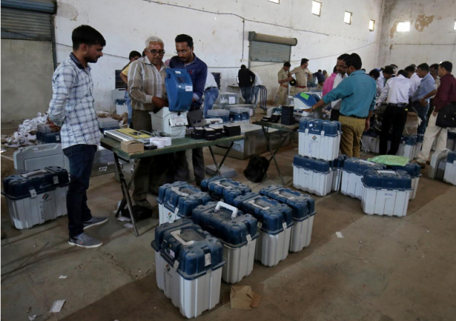Election staff prepare Voter Verifiable Paper Audit Trail (VVPAT) machines and Electronic Voting Machines (EVM) ahead of India's general election at a warehouse in Ahmedabad, March 6, 2019. Lok sabha election 2019