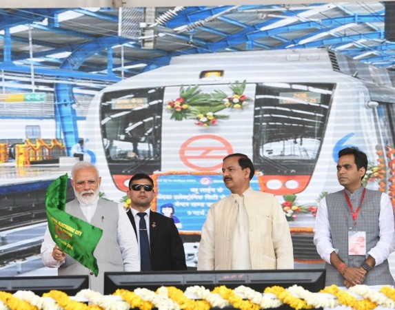 Greater Noida: Prime Minister Narendra Modi flags off Noida City Centre - Noida Electronic City Section of the Delhi Metro's blue line at Greater Noida, Uttar Pradesh on March 9, 2019. Also seen Union Minister of State for Culture Dr. Mahesh Sharma. Prime Minister Narendra Modi