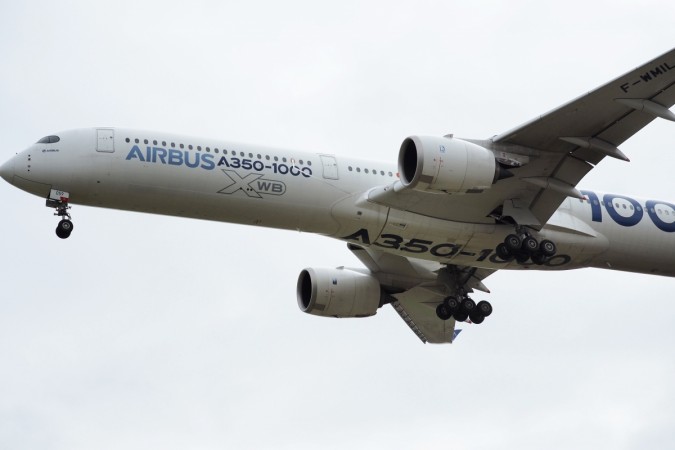An Airbus A350-1000 conducts a test flight over Chateauroux airport, central France, on February 08, 2019. - Measuring nearly 74 metres from nose-to-tail, the A350-1000 is the longest-fuselage version of Airbus' all-new family of twin-aisle, widebody jetliners. Airbus A350-1000