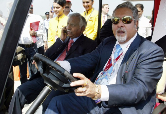 Vijay Mallya (right) rides a buggy with Naresh Goyal during the inauguration of India Aviation at Begumpet Airport in Hyderabad on October 15, 2008. Naresh goyal Vijay mallya