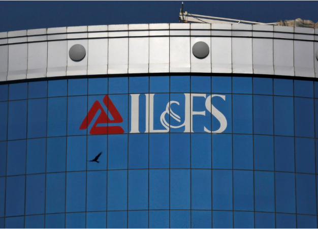 A bird flies next to the logo of IL&FS (Infrastructure Leasing and Financial Services Ltd) installed on the facade of a building at its headquarters in Mumbai, on September 25, 2018. IL&FS