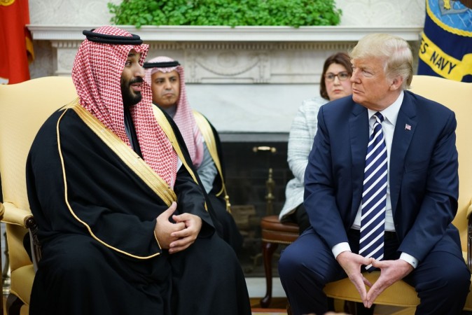 Saudi Arabia's Crown Prince Mohammed bin Salman (L) speaks during a meeting with US President Donald Trump (R) in the Oval Office of the White House on March 20, 2018 in Washington, DC. US-SAUDI-DIPLOMACY