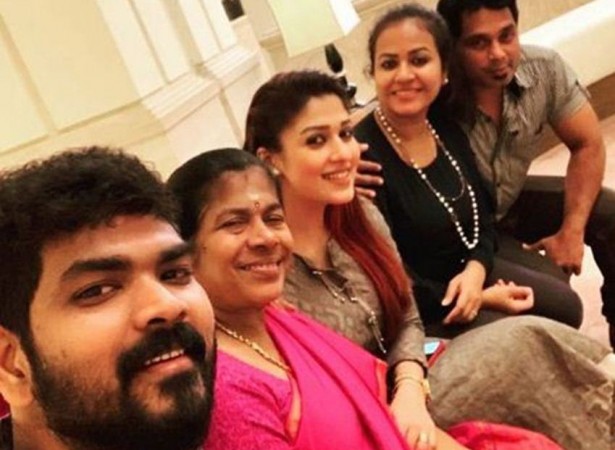 Vignesh Shivan, his mother, Nayanthara along with her sister and brother-in-law are seen in the picture. Vignesh Shivan and Nayanthara