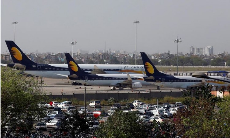 Jet Airways aircraft are seen parked at the Indira Gandhi International Airport in New Delhi, India, April 13, 2019. The airline shut down all operations from April 17. REUTERS/Anushree Fadnavis/File Photo Jet Airways