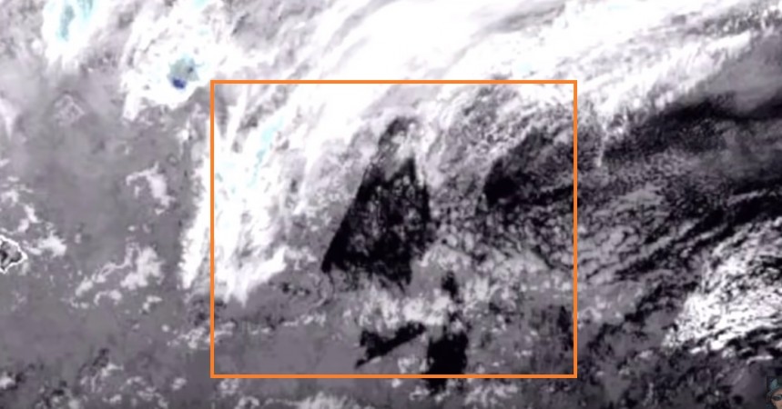UFO rising out of water