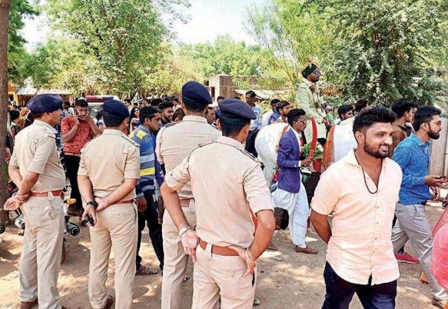 Police force securing the wedding procession of a Dalit youth in Gujarat Police force securing the wedding procession of a Dalit youth in Gujarat