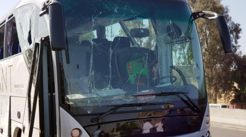 Pictures posted on social media showed a bus with some of its windows blown out or shattered, and debris in the road next to a low wall with a hole in it. giza blast