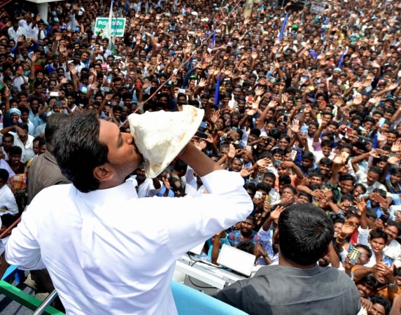 Amaravati: YSR Congress Party (YSRCP) chief Jagan Mohan Reddy blows a conch as he celebrates with party workers after the YSRCP emerged victorious in the Andhra Pradesh Assembly elections in Amaravati, on May 23, 2019. While reservation for locals in private sector jobs is politically potent, businessmen are questioning its economic wisdom. YSR Congress Party (YSRCP) chief Jagan Mohan Reddy blows a conch