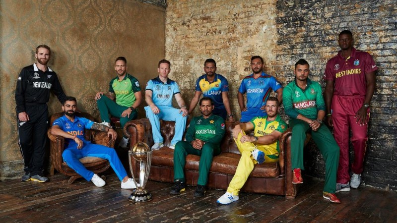 Captains of all ten teams posing with th trophy World Cup capains