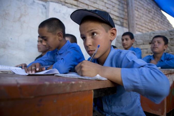 Children in school School buildings are often used as voter registration and polling booths
