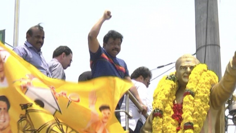 Ram Gopal Varma garlanding NTR's statue on Paipula road in Vijayawada Ram Gopal Varma garlanding NTR's statue on Paipula road in Vijayawada