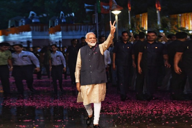 Narendra Modi flashes victory sign after the Bharatiya Janata Party (BJP) pulled off a stunning and historic victory in the 2019 Lok Sabha battle, with the ruling party itself set to win 303 seats in a marked improvement over its 2014 showing that left the opposition dazed and demoralized. Narendra Modi