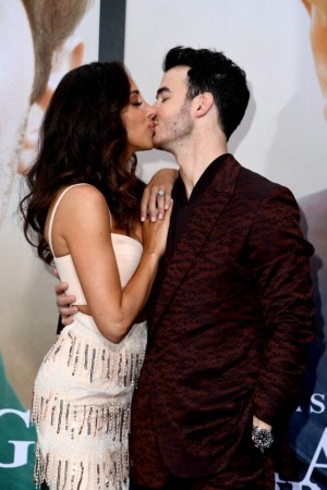 Danielle Jonas and Kevin Jonas kiss at Chasing Happiness premiere. Danielle Jonas and Kevin Jonas kiss at Chasing Happiness premiere