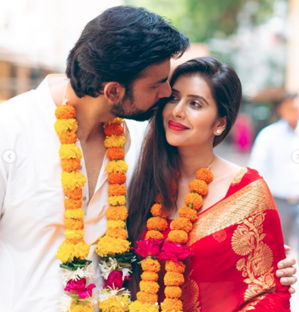   Rajeev Sen kisses the bride Charu Asopa after their wedding 