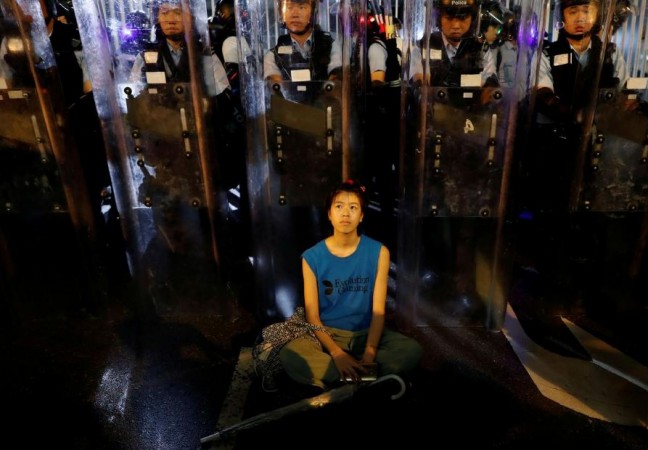 A protester sat down in front of riot police during the demonstration. Hong Kong protests against proposed extradition law