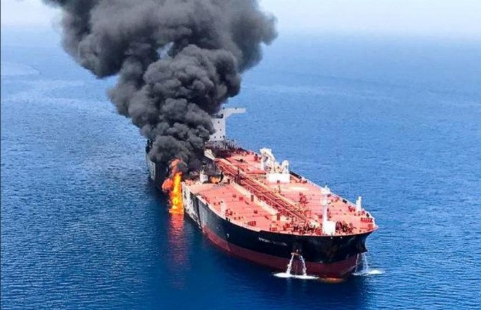 Smoke billows over an oil tanker that was attacked at the Gulf of Oman on June 13. The continuing Middle East tensions and Opec reluctance to ease production cuts are driving up the crude prices with some experts predicting Brent to top $100. Gulf of Oman-tanker