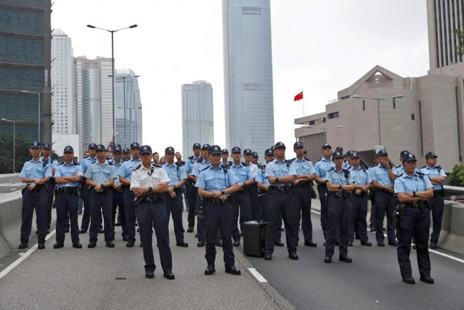 Police stand on guard in Hong Kong on June 17, 2019. Police stand on guard