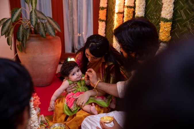 A picture of Yash and Radhika Pandit's daughter Ayra's naming ceremony. Yash-Radhika Pandit Daughter Ayra Naming Ceremony