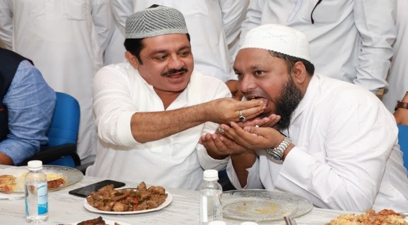 IMA director Mansoor Khan with Minister BZ Zameer Ahmed in an iftaar party. IMA director Mansoor Khan with Minister BZ Zameer Ahmed in an iftaar party.