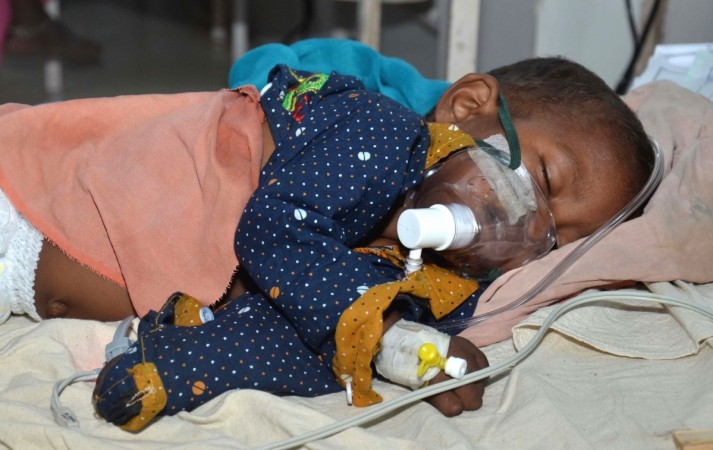 A child with Acute Encephalitis Syndrome (AES) symptoms being treated at hospital in Muzaffarpur. AES Child Hospital