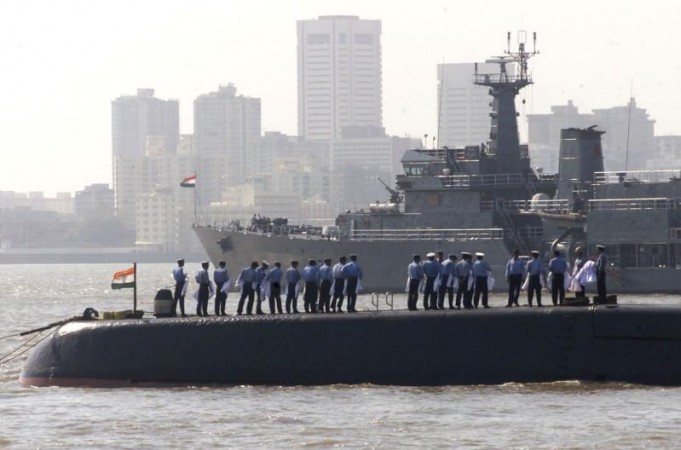 Sailors from the Indian Navy stand on a submarine as Indian as well as foreign warships began to line up off the Bombay coast Indian Navy