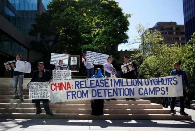 People protest against China's treatment of the Uighur population, in Vancouver, May 8, 2019. Uighur muslim