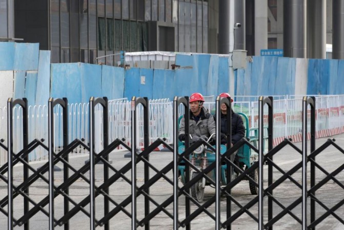 Workers are seen at a construction site in Beijing's central business area, China on January 18, 2019. As slowdown worsens, Chinese banks are facing a crisis. China economy slowdown
