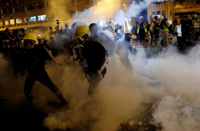 Anti-extradition demonstrators run from tear gas after a march of to call for democratic reforms, in Hong Kong, China July 21, 2019. Hong Kong protests-violent