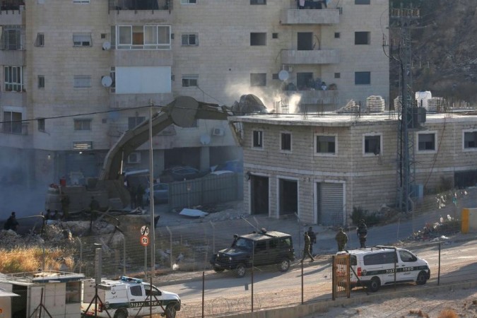 Israeli machinery demolished Palestinian houses in the village of Sur Baher on July 22. Israeli demolition-Palestine