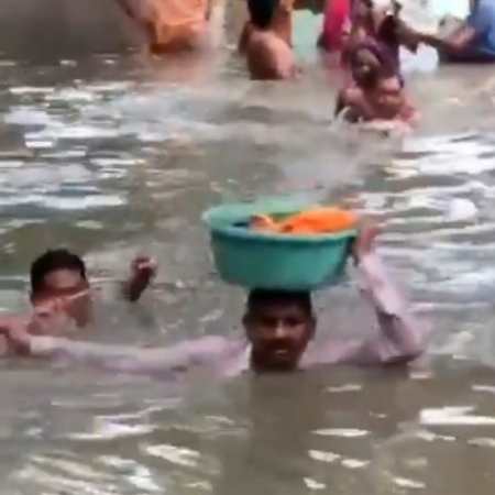 man rescues baby from neck-deep waters in Vadodara