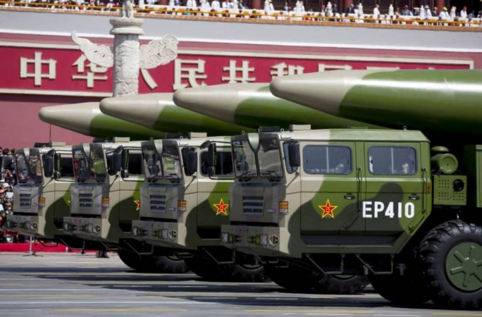 Chinese military vehicles carrying DF-26 ballistic missiles travel in Beijing's Tiananmen Square during a military parade on September 3, 2015. China missile