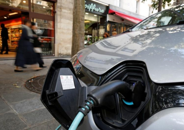 An electric car is being charged in a Paris street, France, September 12, 2017. REUTERS/Philippe Wojazer Electric Car