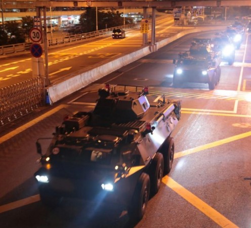 Military vehicles of the People's Liberation Army (PLA) passes Huanggang Port for a routine troop rotation in Hong Kong, August 29, 2019. PLA military vehicles in Hong Kong