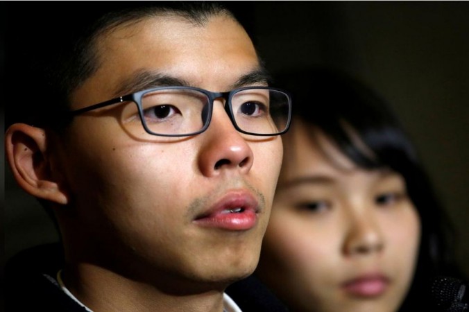 Former student leader Joshua Wong stands beside student activist Agnes Chow after being released on bail at the High Court in Hong Kong, China, January 23, 2018. Joshua Wong and Agnes Chow